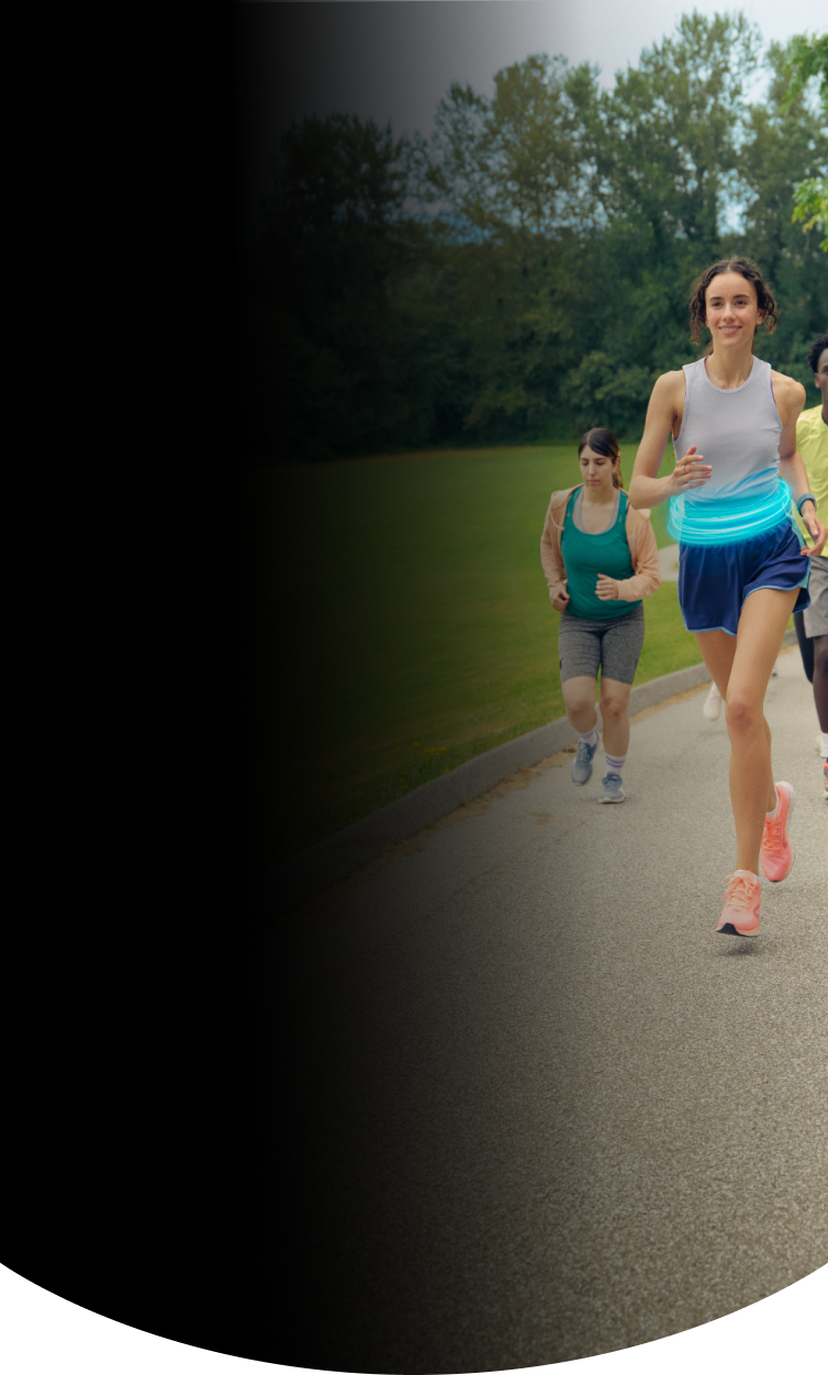 Group of people running together in a field