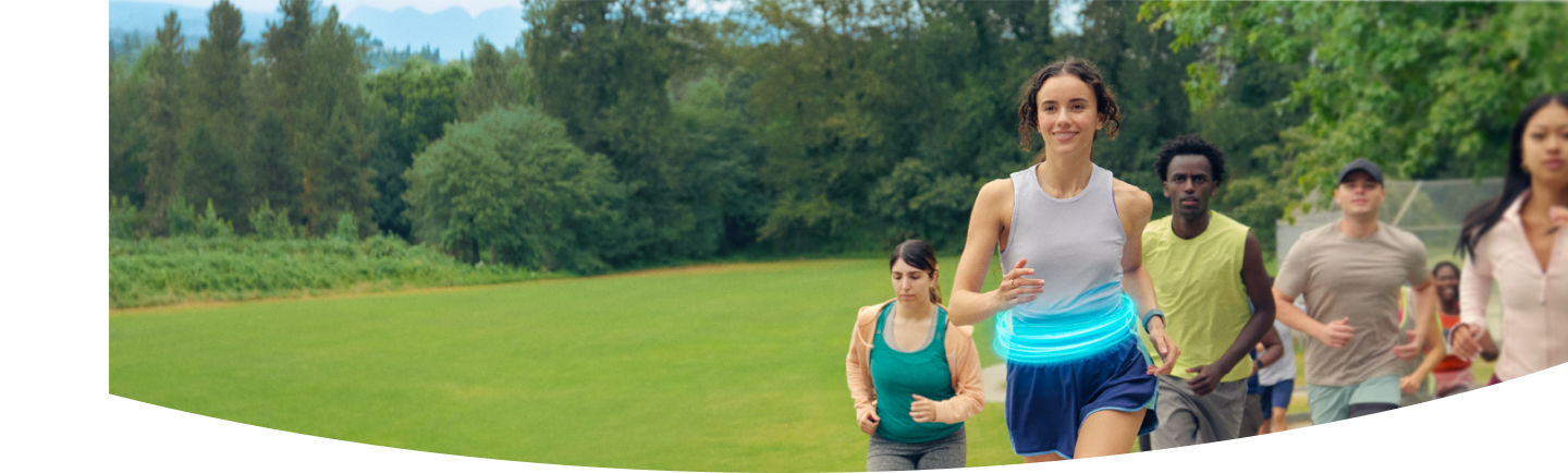 Group of people running together in a field
