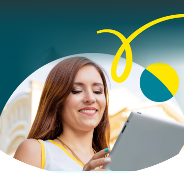 Woman looking down smiling at her tablet