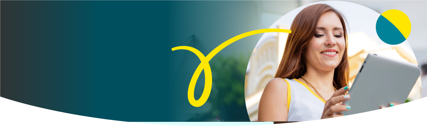 Woman looking down smiling at her tablet