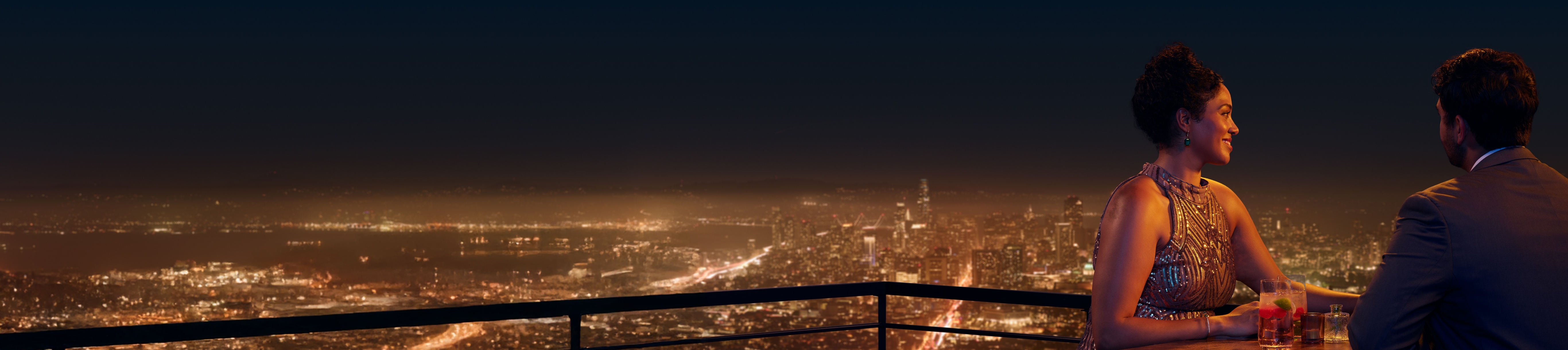 Man and woman chatting on a rooftop