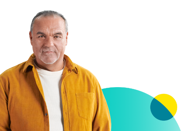 Man in yellow jacket and white shirt staring straight ahead in front of teal and yellow circles