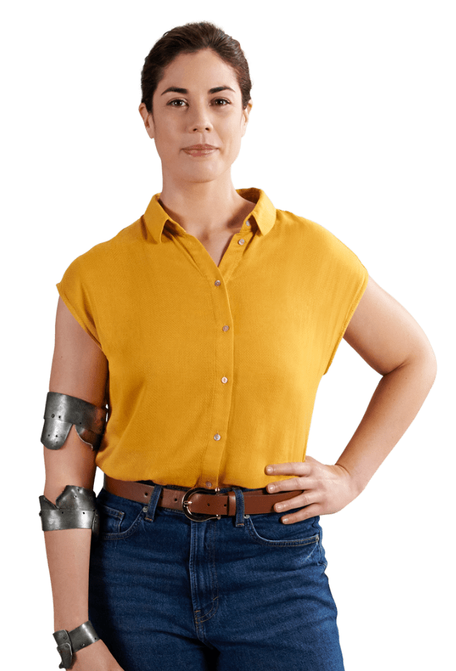 Woman standing and wearing yellow shirt and jeans with bent metal braces on her arm