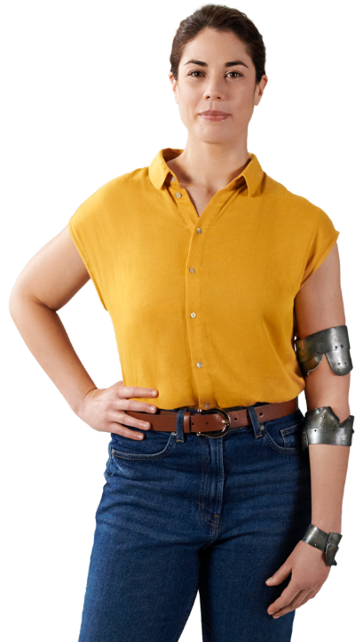 Woman standing and wearing yellow shirt and jeans with bent metal braces on her arm