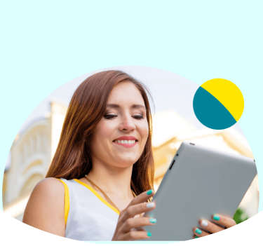 Woman smiling down at tablet