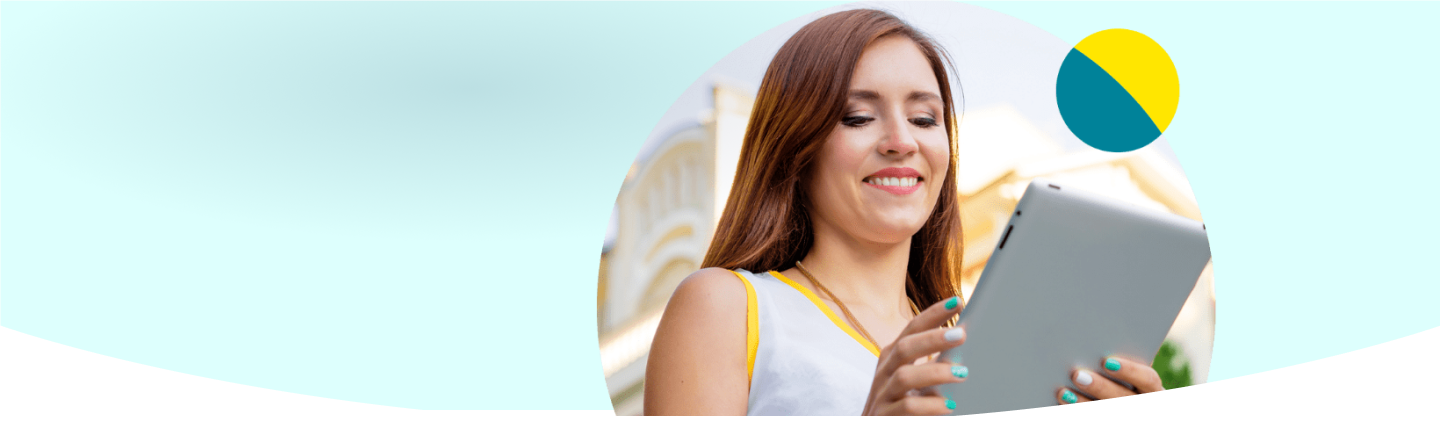 Woman smiling down at tablet