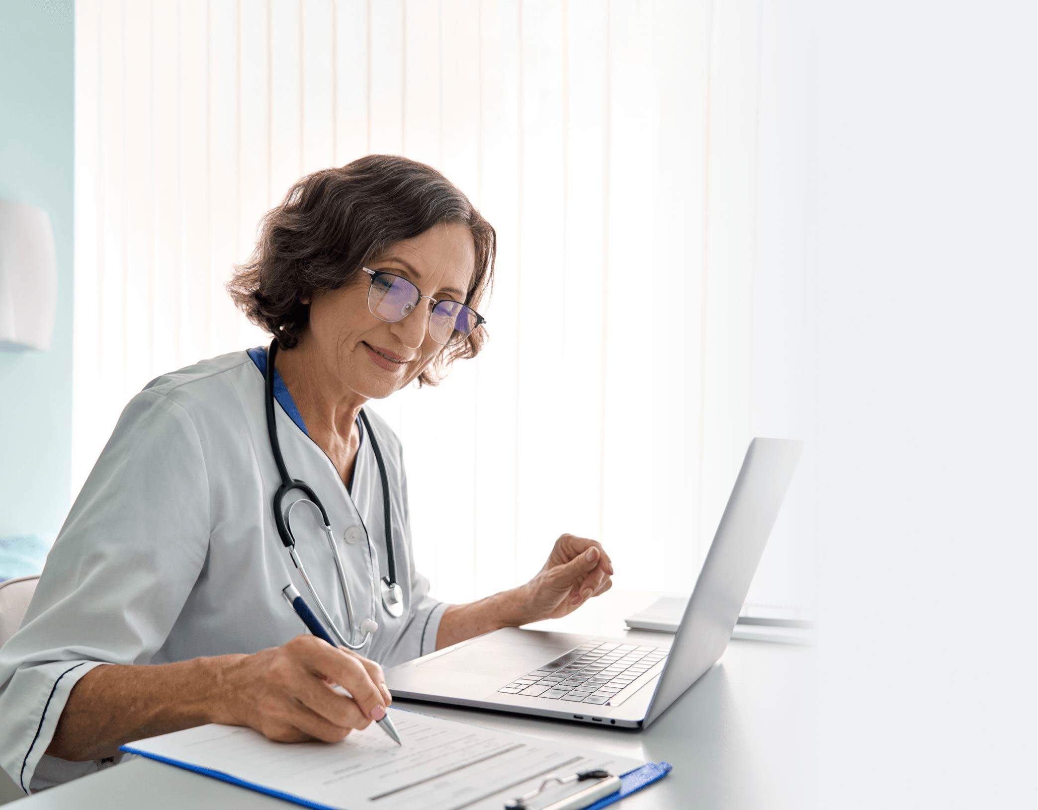 Healthcare provider filling out a form